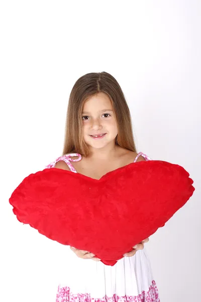 Porträtt av vacker liten flicka med hjärta — Stockfoto