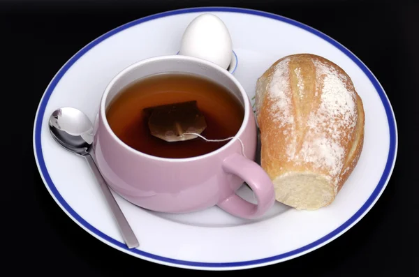 Breakfast tea, bread and eggs