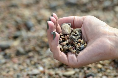 Hand with stones clipart