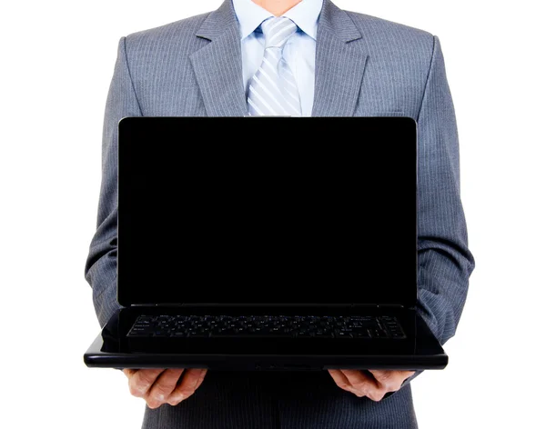 Hombre de negocios sosteniendo portátil en blanco — Foto de Stock