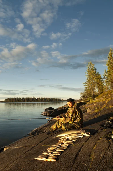 A fisherman on the lake — Stock Photo, Image