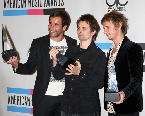 Muse - Christopher Wolstenholme, Matthew Bellamy ja Dominic Howard — kuvapankkivalokuva