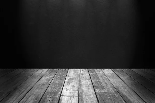 Black concrete wall and wooden floor — Stock Photo, Image