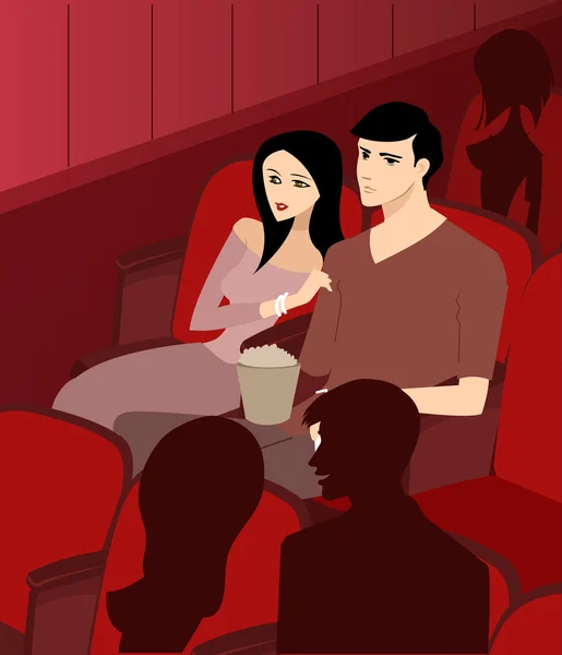 A couple at the theatre watching a movie — Stok fotoğraf