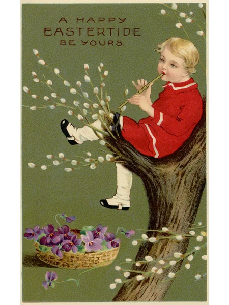 A vintage Easter postcard of a basket of violets and a boy playing a flute in a pussy willow tree — Stock Photo, Image