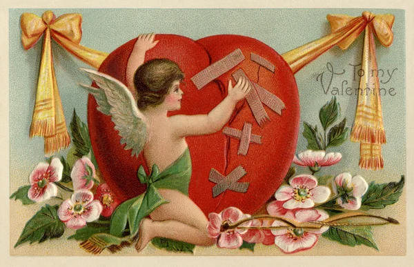 A vintage Valentines card with a cherub patching up a broken heart — Stock Photo, Image