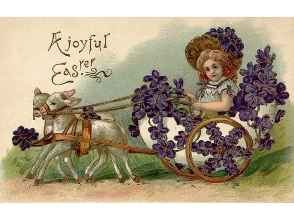 Una postal vintage de Pascua de una chica montada en un vagón lleno de violetas siendo jalada por dos corderos —  Fotos de Stock