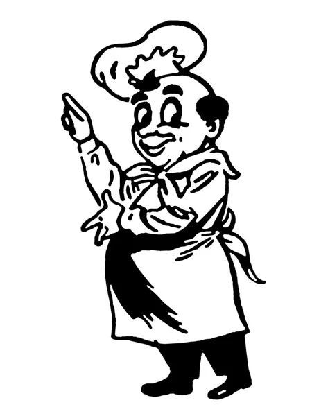 Um chef de aparência feliz segurando um garfo de tamanho superior — Fotografia de Stock