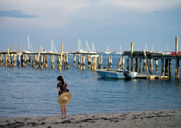 Woman Looking Contemplatively at Water Near Pier — Stock Photo, Image