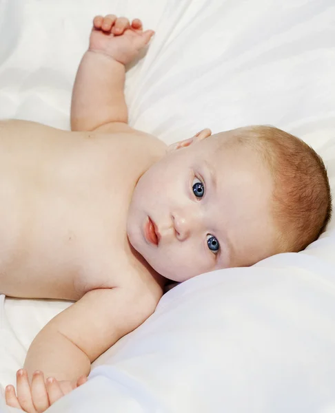 Baby boy with blue eyes looking at the camera — Stock Photo, Image