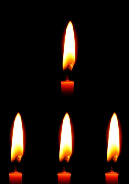 Brennende Kerzen vor schwarzem Hintergrund — Stockfoto