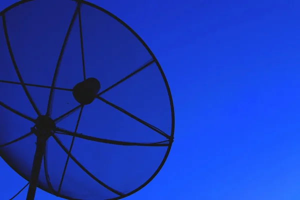 Satellite dish in blue sky — Stock Photo, Image