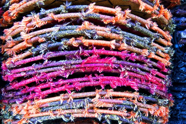 stock image Homespun mat of colored ribbons