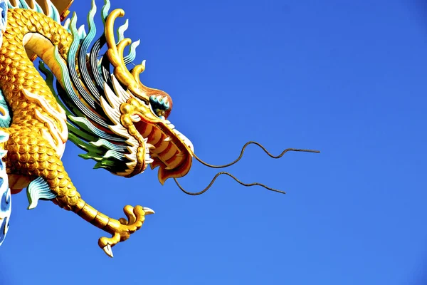 Dragon statue on pillars with blue sky Stock Photo
