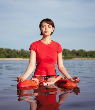 Young woman making Yoga exercises clipart