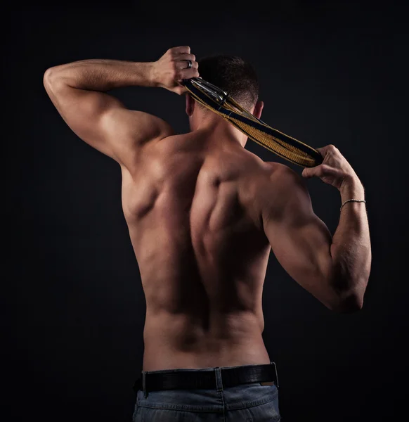 Мышечный голый мужчина со спины Стоковая Картинка