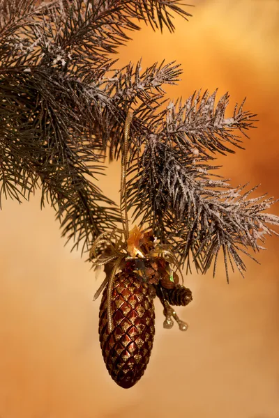 Fresh green pine branches and a gold bump — Stock Photo, Image