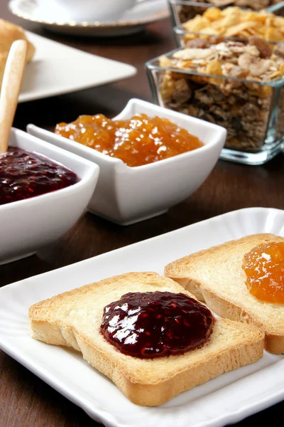 Toasted with marmalade on the brown table — Stock Photo, Image