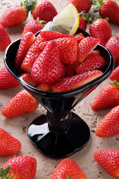Black glass with strawberry — Stock Photo, Image