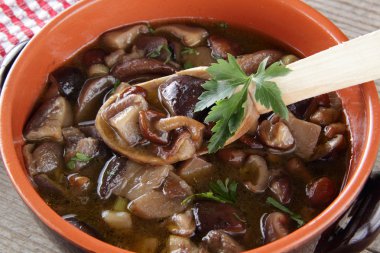 A rustic dish with mushrooms clipart