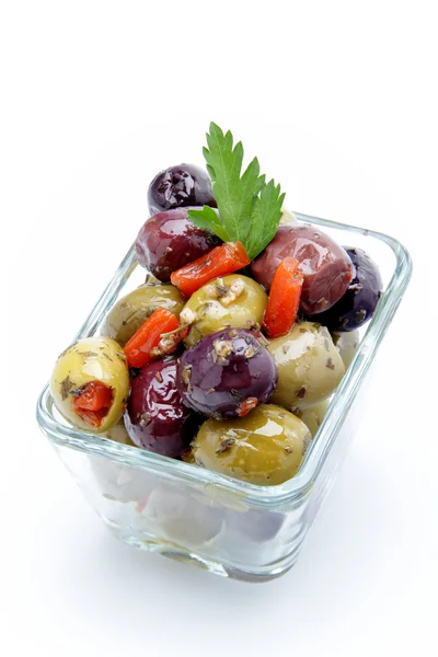 Mixed olives in oil on white background — Stock Photo, Image