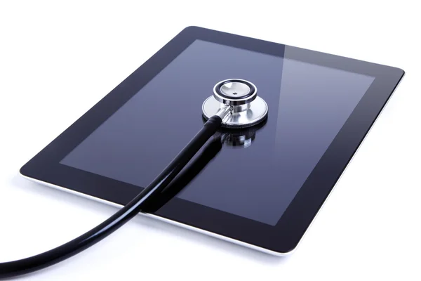 Digitale Tablette mit Stethoskop isoliert auf weiß Stockfoto