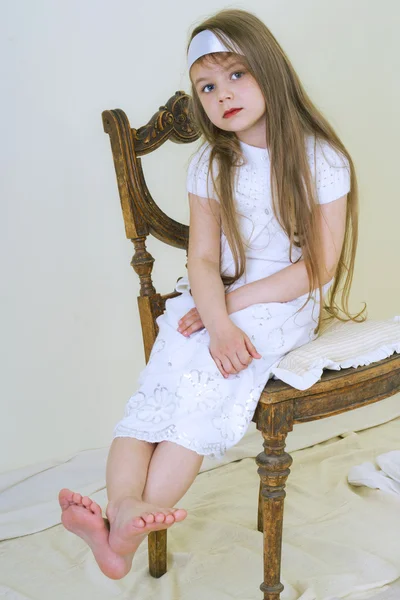 Little girl on a chair — Stock Photo, Image