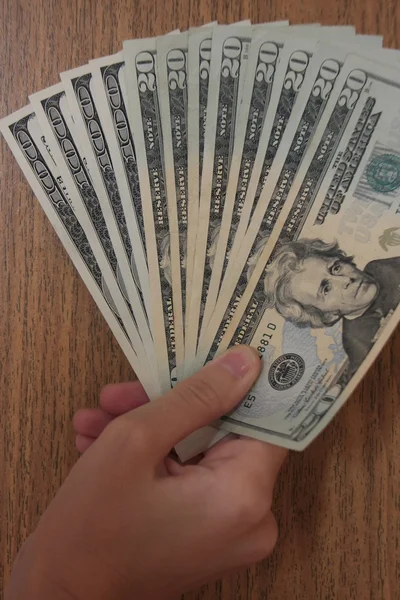 Рука с долларами — стоковое фото