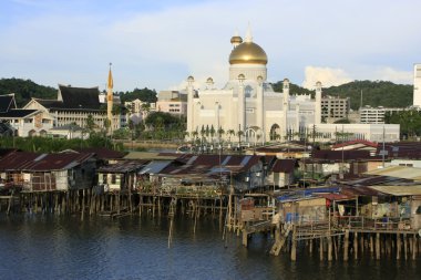 Stilt houses of Kampong Ayer and Sultan Omar Ali Saifudding Mosque, Bandar Seri Begawan, Brunei, Southeast Asia clipart
