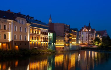 Riverside town night view clipart