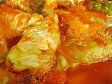 Cabbage rolls in sauce close-up clipart