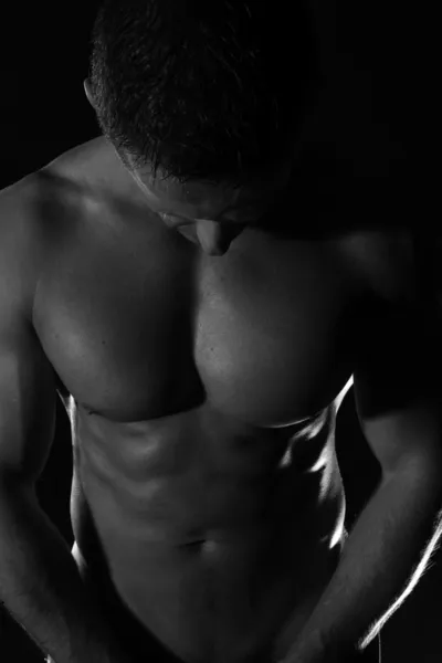 Uomo muscoloso-ról Stock Kép