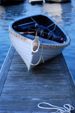 Blue Dinghy on the Dock clipart