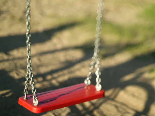 Red swing — Stock Photo, Image