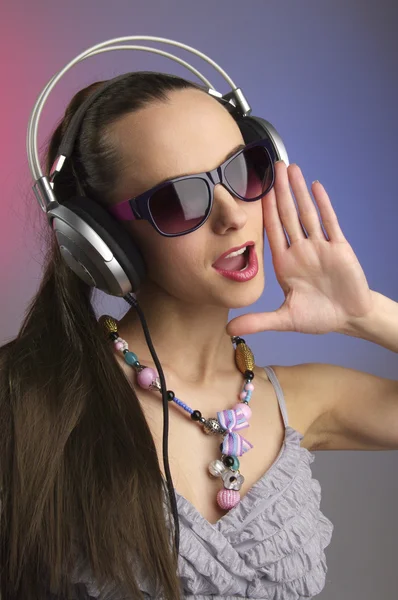 Girl on a party with headphones — Stock Photo, Image