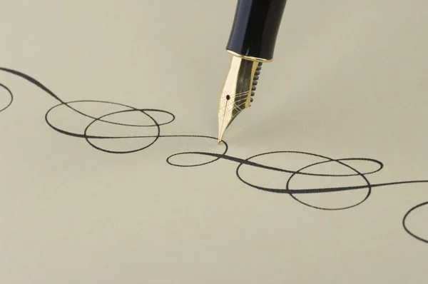 Elegant pattern wtitten by gold pen — Stock Photo, Image