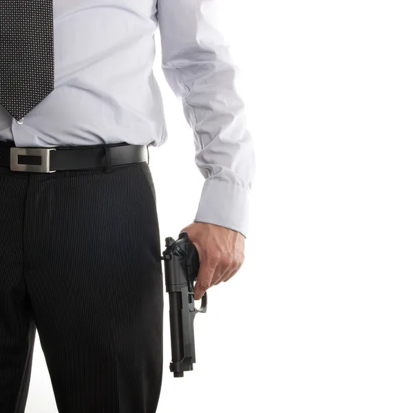 Muž v obleku s pistolí v ruce — Stock fotografie