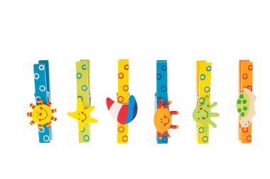 Colorful clothespins with wooden figures standing in a row clipart