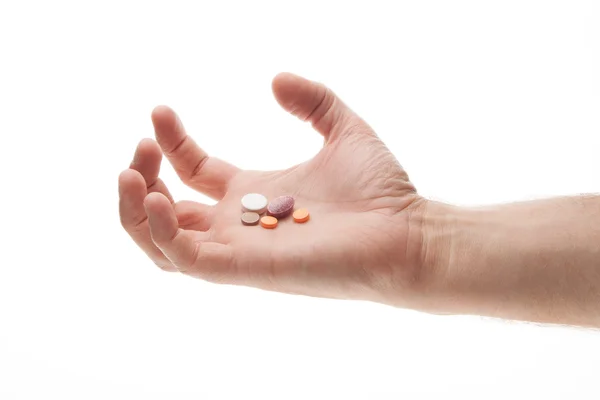 stock image Hand holding pills in an angry or frustrated manner