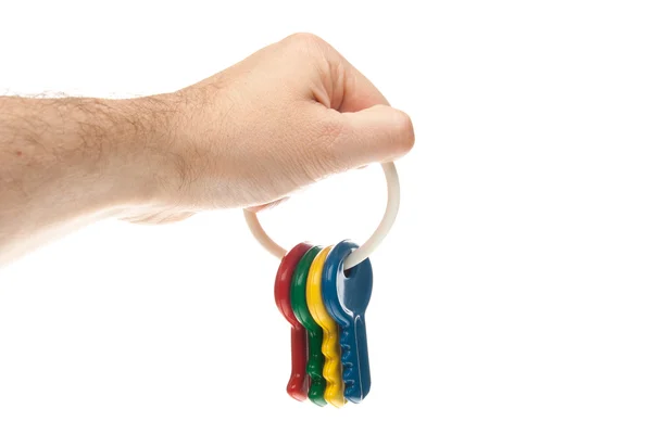 Hand holding plastic key chain — Stock Photo, Image