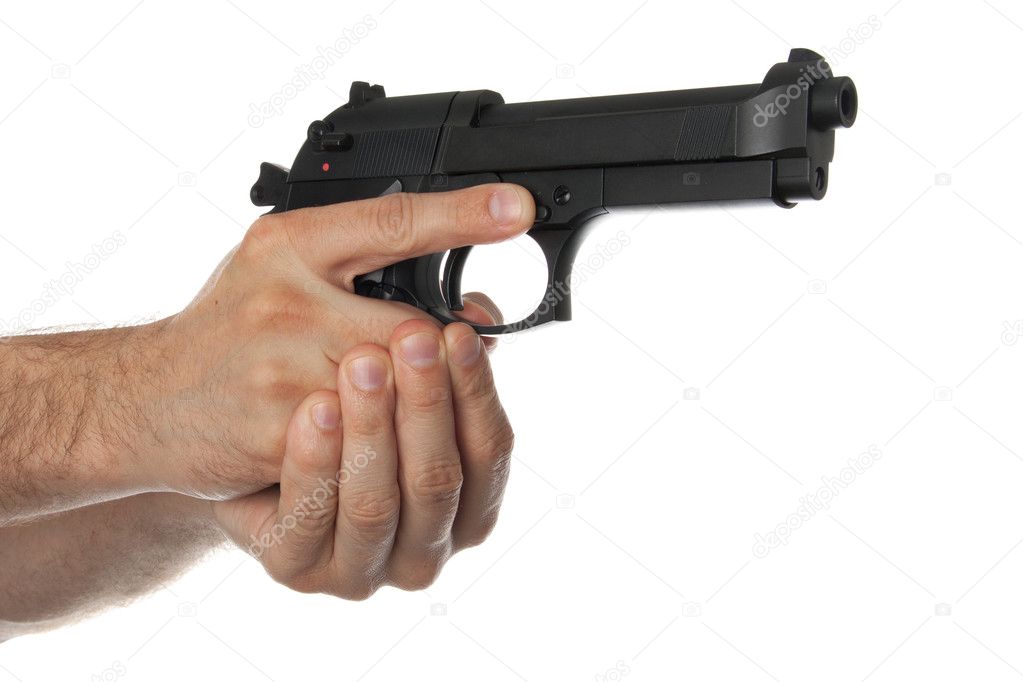 Two hands holding a gun with finger off the trigger
