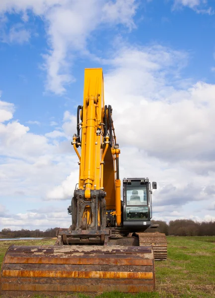 stock image Used yellow excavator