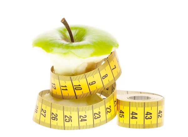 Dieting concept Green apple with measuring tape — Stock Photo, Image