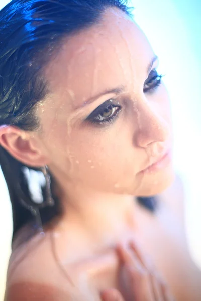 stock image Young woman under shower spray