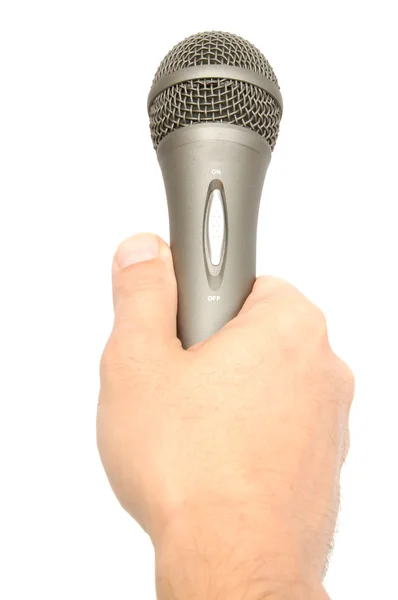 Mano sosteniendo un micrófono — Foto de Stock