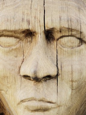 Wooden sculpture of a woman clipart