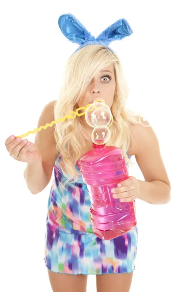 Woman blowing bubbles easter — Stock Photo, Image