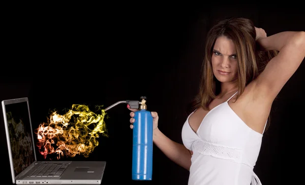 Woman torching computer — Stock Photo, Image