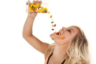 Woman pouring jelly beans mouth clipart