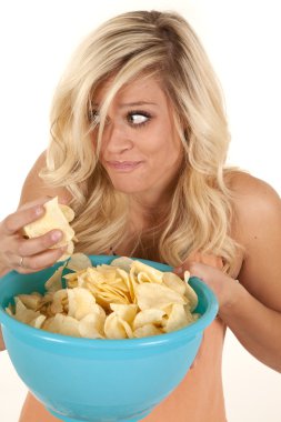 Woman sneaking chips clipart